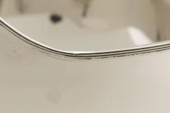 Flamant Azy, Kom, Nikkel