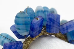 Flamant Ezana, Servetring, Kralen