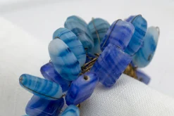 Flamant Ezana, Servetring, Kralen