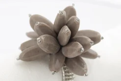 Flamant Otis, Servetring, Kralen